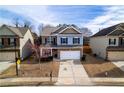 Inviting two-story home with brick accents, double garage, and well-maintained lawn in a residential area at 1390 Napa Valley Sw Dr, Lawrenceville, GA 30045