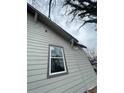 A close up of home's exterior showing the siding and a window at 1406 Allene Sw Ave, Atlanta, GA 30310