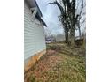 Exterior view showing home siding, backyard space, and foliage at 1406 Allene Sw Ave, Atlanta, GA 30310