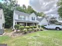 Charming two-story home featuring a lush green lawn and a classic suburban appeal at 2782 Wynhaven Oaks Way, Lawrenceville, GA 30043