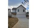 Inviting two-story home with attached garage and newly laid yard at 5115 N Pratt St, Covington, GA 30014