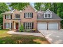 Gorgeous brick home with a manicured lawn and a two-car garage at 5485 Brookstone Nw Dr, Acworth, GA 30101