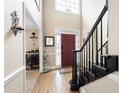 Elegant foyer featuring hardwood floors, high ceilings and an adjacent staircase at 5485 Brookstone Nw Dr, Acworth, GA 30101