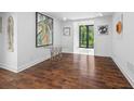 Bright sitting area with hardwood floors, neutral walls, and view to the backyard at 11260 Houze Rd, Roswell, GA 30076