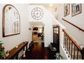 Inviting foyer with hardwood floors, a staircase with iron spindles, and an open view to the living room at 139 6Th St, Auburn, GA 30011