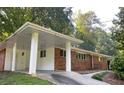 Brick home with a convenient covered carport and manicured lawn at 2764 Riggs Dr, Atlanta, GA 30344