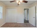Cozy bedroom featuring a ceiling fan, closet, neutral carpet and ample natural light at 158 Polar Rock Sw Dr, Atlanta, GA 30315