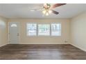 Spacious living room with modern ceiling fan, hardwood floors and natural light streaming in at 158 Polar Rock Sw Dr, Atlanta, GA 30315
