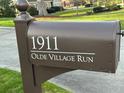 Close-up of a stylish mailbox displaying the house number and street name, '1911 Olde Village Run' at 1911 Olde Village Run, Dunwoody, GA 30338