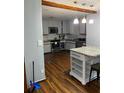 Well-lit kitchen features an island, stainless steel appliances, and stylish backsplash at 3630 High Point Sw Ln, Atlanta, GA 30331