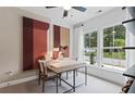 Bright home office with large windows, modern art, and a contemporary desk with seating at 2537 Astaire Ct, Atlanta, GA 30318