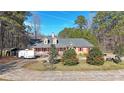 Inviting single-story home with a front porch and manicured landscaping at 210 Cowan Rd Se, Conyers, GA 30094