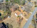 High angle shot displaying the well-maintained lawn and proximity to neighboring homes at 303 Wood Wind Dr, Woodstock, GA 30189