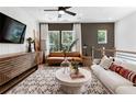 Inviting living room featuring modern decor, stylish furniture, plush rug, and abundant natural light at 2539 Astaire Ct, Atlanta, GA 30318