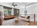 Inviting living room featuring modern decor, stylish furniture, plush rug, and abundant natural light at 2539 Astaire Ct, Atlanta, GA 30318