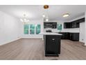 Modern kitchen featuring stainless steel appliances, an island and sleek black cabinets at 2932 Valley Ridge Dr, Decatur, GA 30032