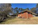 Fenced backyard with a well-maintained lawn, offering a safe and private outdoor space for recreation at 4218 Hideaway Dr, Tucker, GA 30084