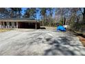 Expansive driveway leading to a brick home, offering plenty of parking space and convenient access at 4218 Hideaway Dr, Tucker, GA 30084