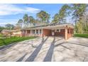 Ranch style home features a brick facade and covered carport at 4218 Hideaway Dr, Tucker, GA 30084