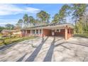 Ranch style home features a brick facade and covered carport at 4218 Hideaway Dr, Tucker, GA 30084