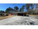 Charming brick home featuring a long driveway and a covered front porch at 4218 Hideaway Dr, Tucker, GA 30084