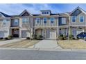 Charming townhomes showcase varied facades, complemented by well-kept landscaping and private driveways at 5264 Mill Way, Stone Mountain, GA 30083