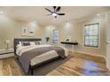 Comfortable bedroom with wood floors, ceiling fan, and natural light at 2436 Green Hollow Ct, Conyers, GA 30012