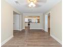 Bright open-concept living room featuring wood floors and a view into a modern kitchen at 3716 Loren Dr, Decatur, GA 30032