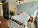 Spacious bedroom with natural light, walk-in closet, and decorative rug at 800 Peachtree Ne St # 8415, Atlanta, GA 30308