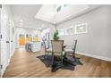 Bright dining area with a skylight and hardwood floors with adjacent kitchen at 395 W Lake Nw Ave, Atlanta, GA 30318
