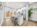 Modern kitchen featuring stainless steel appliances, granite countertops, and a breakfast bar at 395 W Lake Nw Ave, Atlanta, GA 30318