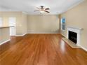 Spacious living room features hardwood floors, fireplace, and plenty of natural light at 2470 Arnold Mill Rd, Lawrenceville, GA 30044