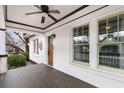 Covered front porch featuring a ceiling fan, view of the front door, and a cozy seating area at 1106 Sanders Se Ave, Atlanta, GA 30316