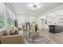Bright living room with modern lighting, neutral colors and wood flooring at 169 Wadley Nw St, Atlanta, GA 30314