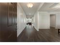 Elegant entryway with hardwood floors, decorative molding, and an open view into the living spaces at 3218 Hidden Valley Cir, Lawrenceville, GA 30044