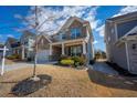 Charming home with stone and siding exterior, landscaped front yard, and inviting entrance at 120 Woodford Ln, Canton, GA 30115