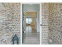 Inviting foyer with stone walls and an open view into the light-filled living spaces at 120 Woodford Ln, Canton, GA 30115