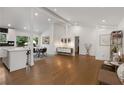 Bright, open-concept living area featuring hardwood floors, white walls and modern furnishings at 3306 Briarcliff Ne Rd, Atlanta, GA 30345