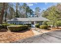 Charming single-story home with manicured landscaping, stone walkway, and a welcoming front entrance at 6475 Holland Dr, Cumming, GA 30041