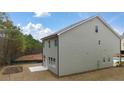 New home featuring a large backyard with a concrete patio at 1084 Georgian Point Dr, Lawrenceville, GA 30045