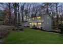 An alternate angle view of the charming white two-story home with green lawn at 2818 Thornbriar Rd, Atlanta, GA 30340