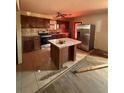 Kitchen features stainless steel appliances, an island, and ample cabinet space for storage and meal prep at 633 Langston Sw Dr, Atlanta, GA 30315