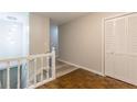 Bright entryway featuring hardwood floors, white trim, and a staircase leading to the upper level at 8980 Country Club Dr, Douglasville, GA 30134