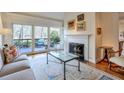 Cozy living room with fireplace and sliding doors leading to the deck at 3994 Columns Dr, Marietta, GA 30067