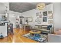 Open-concept living space boasting hardwood floors, modern furnishings, and ample natural light at 44 Peachtree Ne Pl # 1225, Atlanta, GA 30309