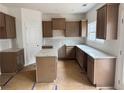 Open kitchen with granite counters, a center island, and ample cabinet space at 124 Bloomfield Cir, Canton, GA 30114