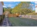 Private backyard with a wooden fence, offering a peaceful outdoor space at 2316 Watson Fain Trl, Loganville, GA 30052