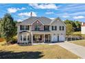 Beautiful two-story home with a well-manicured lawn and an attached two-car garage at 2316 Watson Fain Trl, Loganville, GA 30052