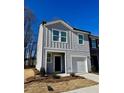 Attractive two-story home with a one car garage, complementary siding and manicured landscaping at 3017 Acacia Cir, Douglasville, GA 30135