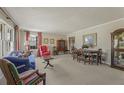 Bright living room with large windows, neutral carpet, and classic furnishings at 3439 Elm Creek Nw Dr, Marietta, GA 30064